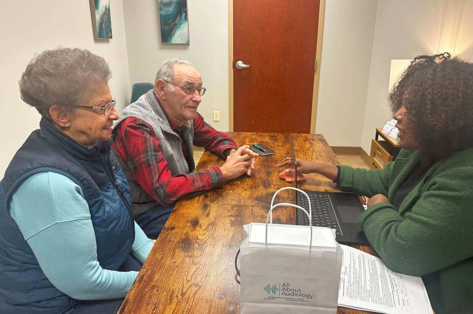 A couple at a hearing aid fitting