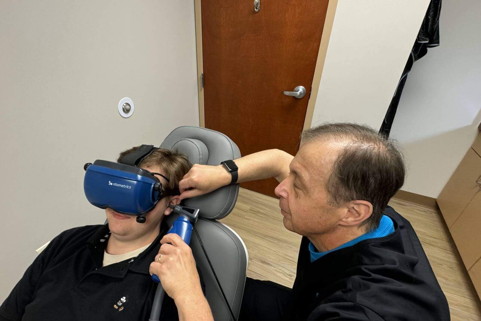 A patient wearing video goggles during a balance test